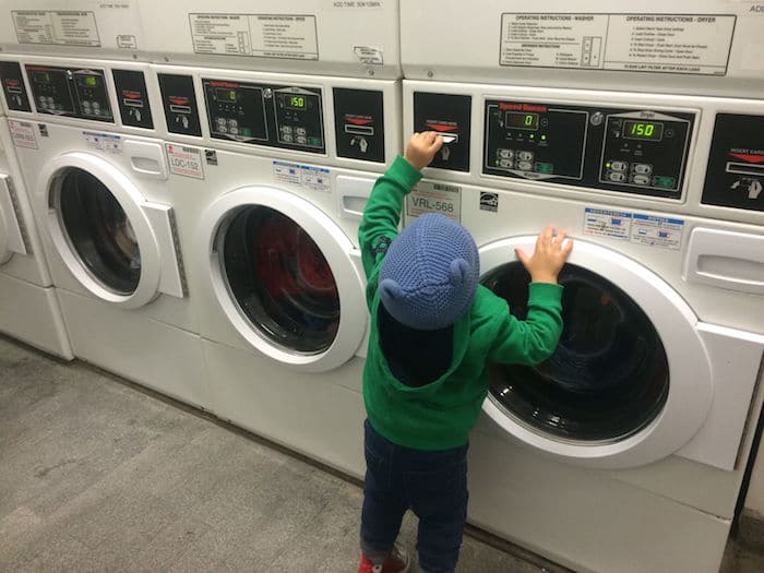 Visit ROAM THE GNOME Family Travel Website Directory for SUPER DOOPER FUN ideas for family vacations around the world. Search by city. Photo - Studio Plus New York apartment laundry