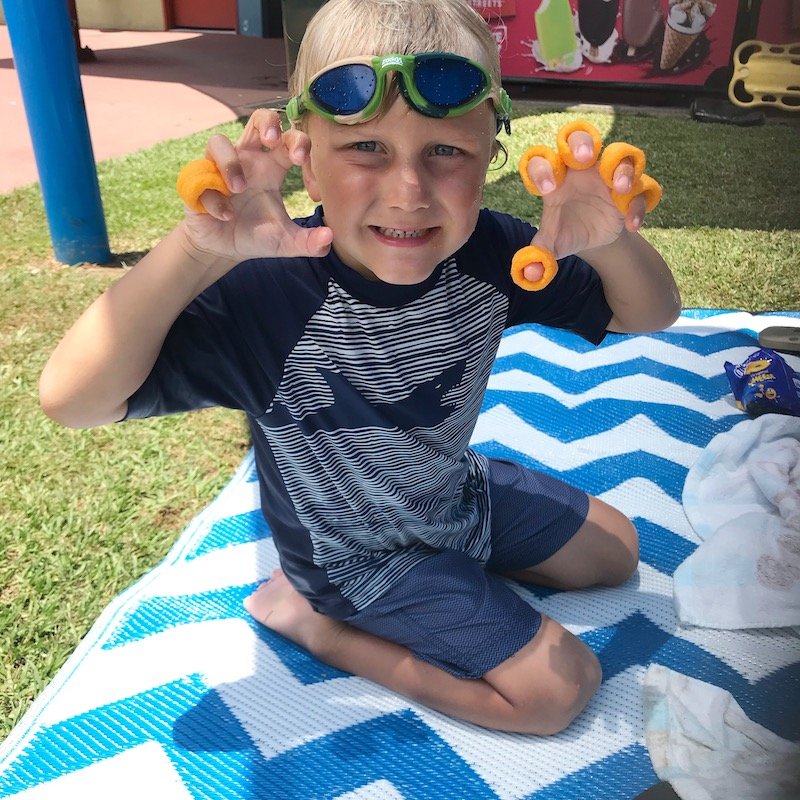 Mullumbimby Pool_Jack eating cheezels pic