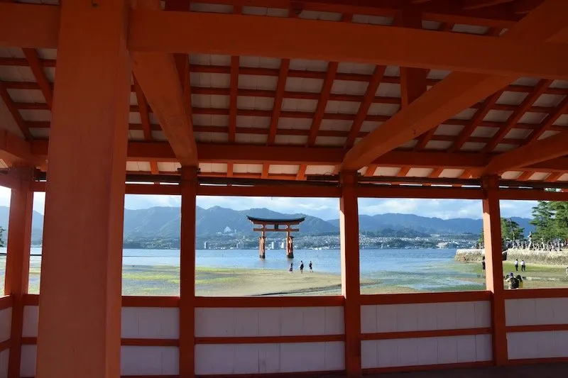hiroshima day trip to miyajima island view of red torii gates from shrine pic