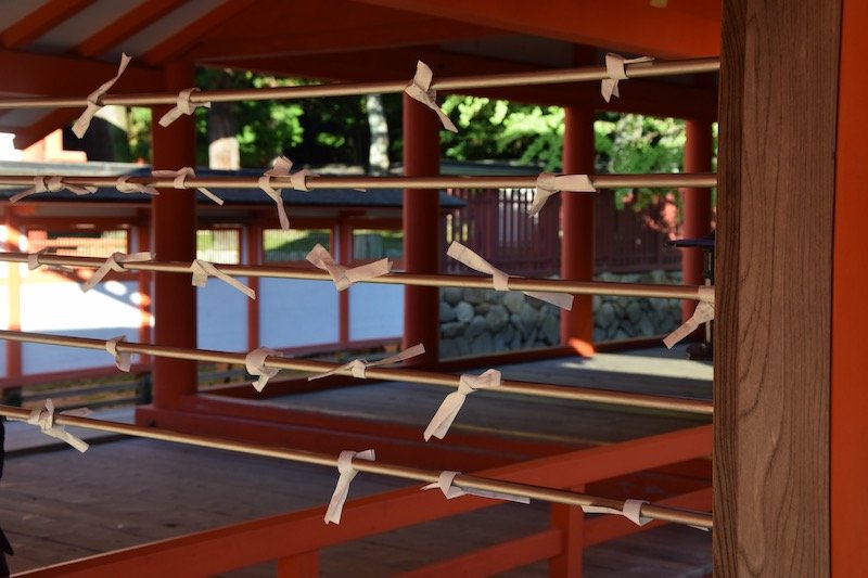 omikuji papers at miyajima shrine japan