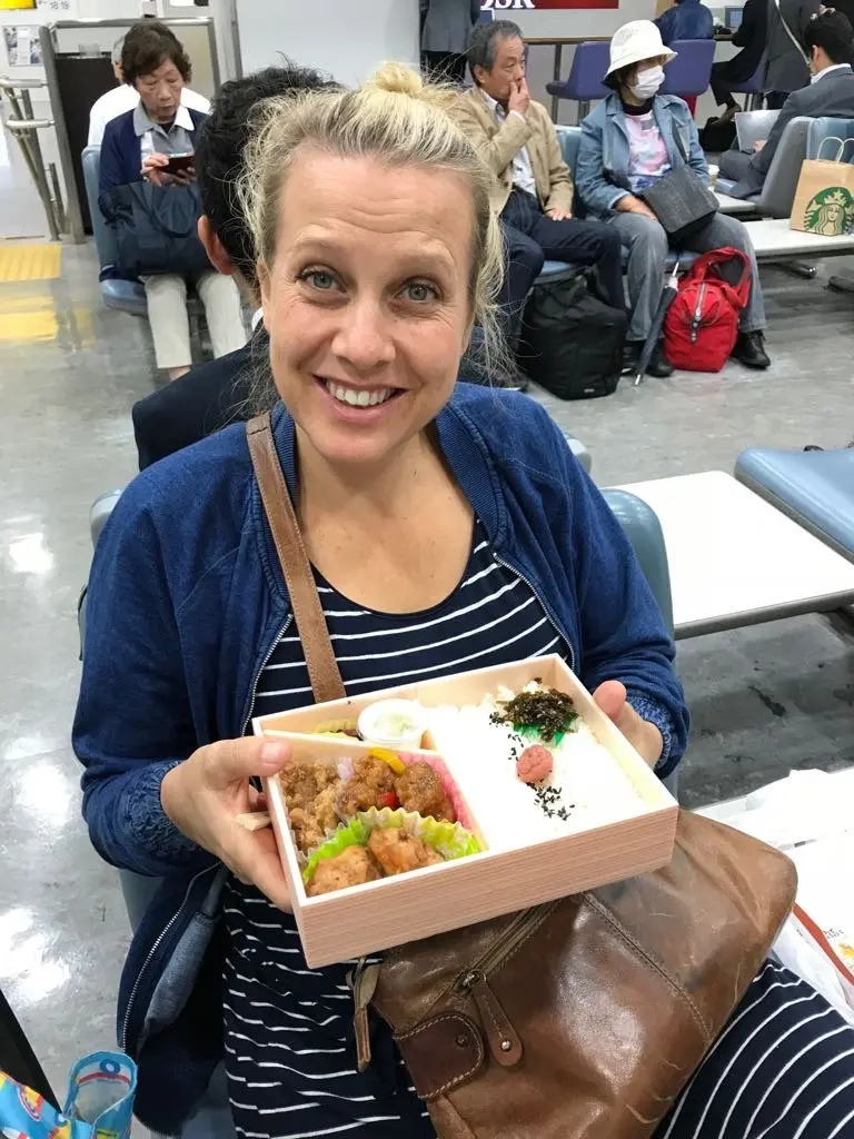amber eating bento at tokyo train station pic