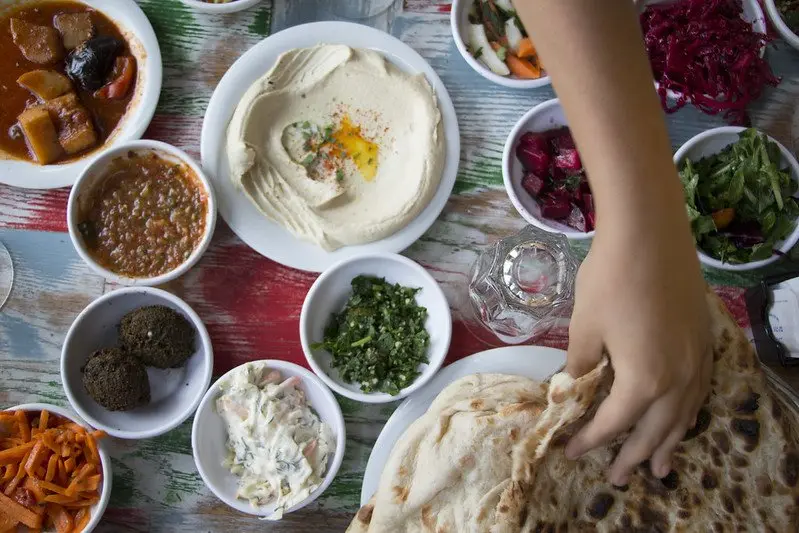 hommus share table by pierre janineh flickr