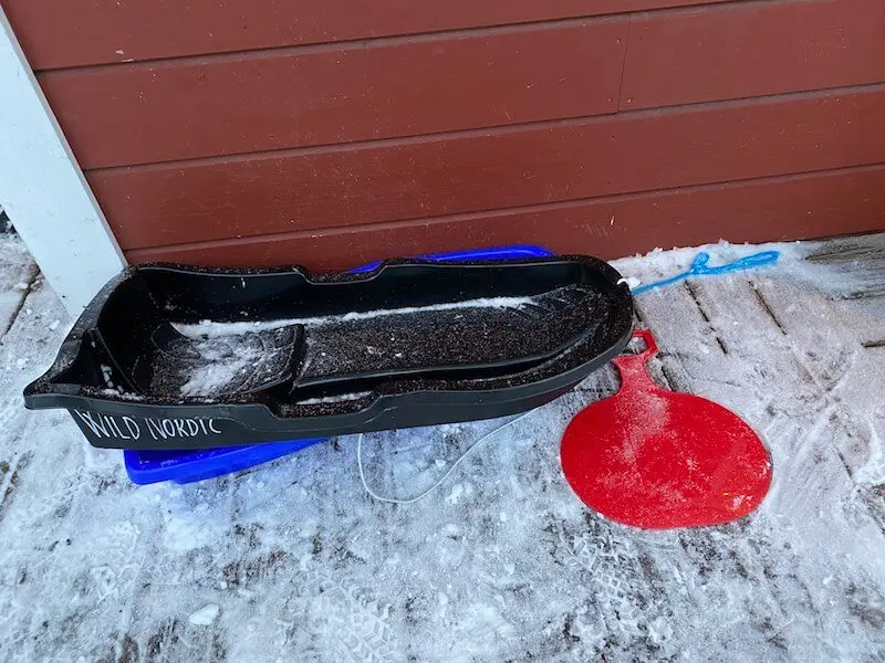 image - santa claus holiday village sleds on verandah