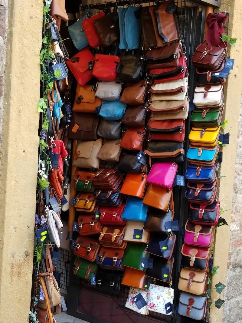 italian leather handbags wall of bags - public domain pics copy