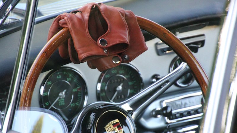 leather gloves on steering wheel pic