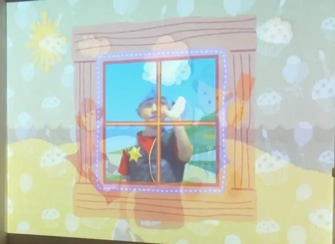 play-school-presenters-look-through-window