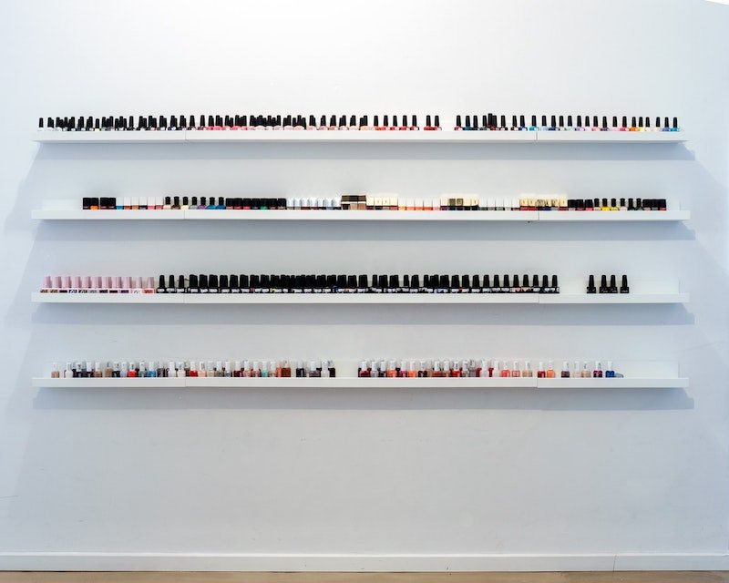 nail polish collection on floating shelves by yannes-kiefer