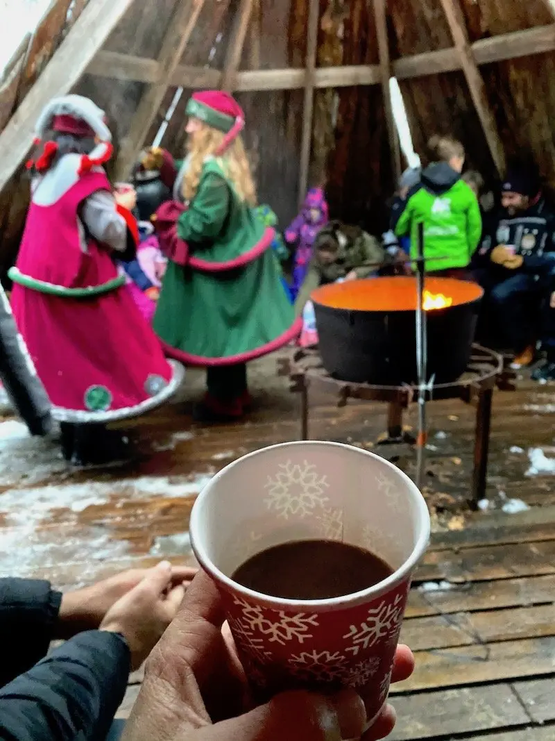Image - Lapland elves giving out hot chocolate at santa claus secret forest of joulukka