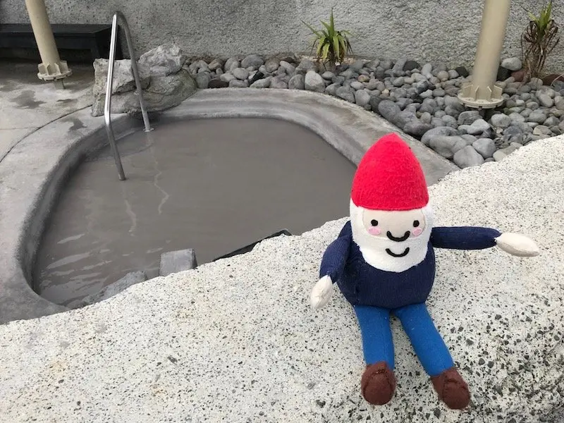 Photo- mud bath pool with roam the gnome