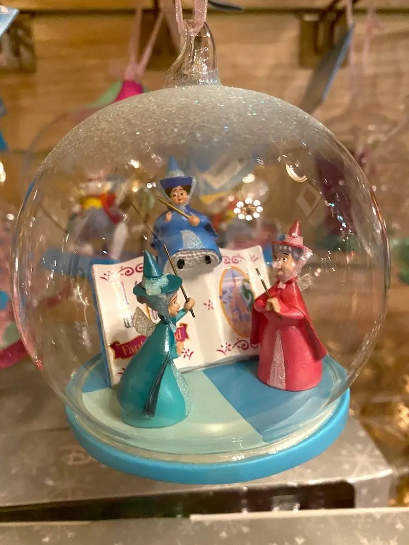 image - disneyland paris christmas globe with Flora, Fauna, and Merryweather