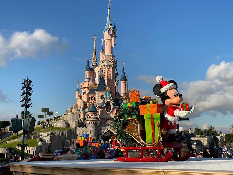 image - disneyland paris christmas mickey statues in front of castle