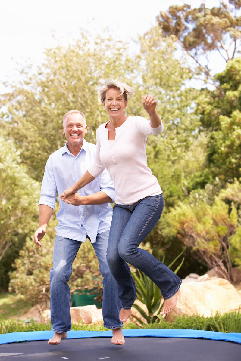 image - adults jumping on the trampoline