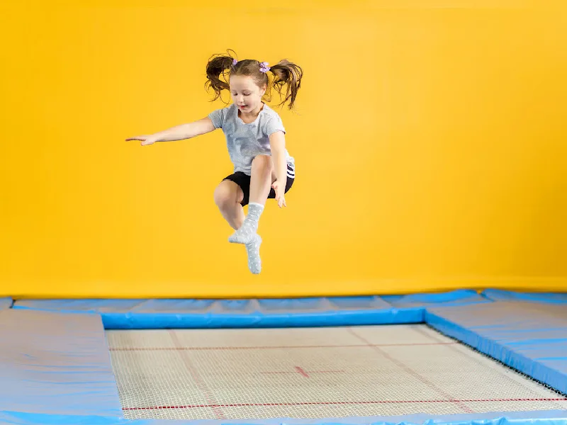Trampoline jumping. Children sport games. Happy cartoon kids have fun. By ONYX