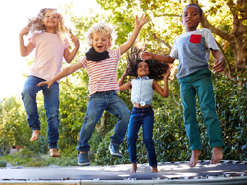 Trampoline jumping. Children sport games. Happy cartoon kids have fun. By ONYX
