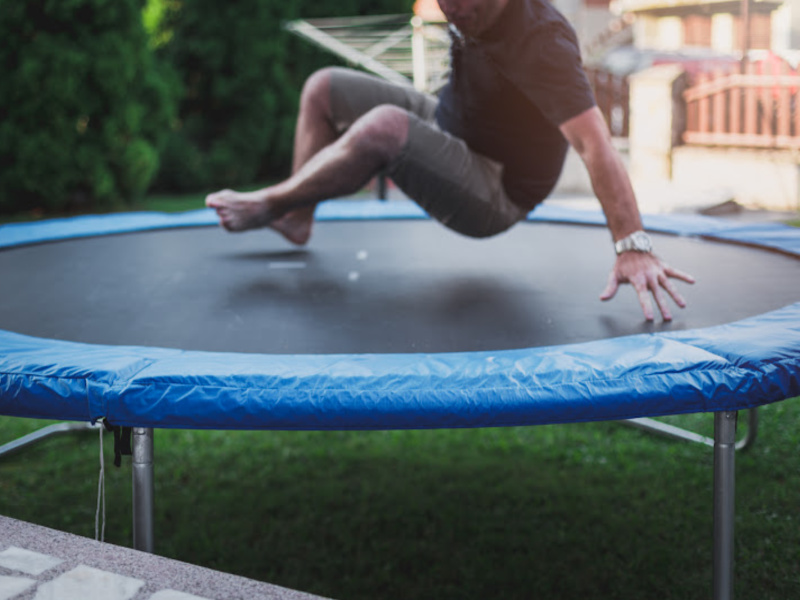 image- man on trampoline