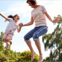 image - mum and daughter jumping on the trampoline