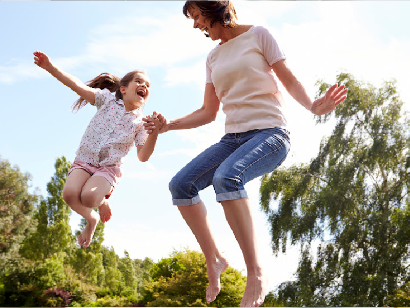 image - mum and daughter jumping on the trampoline